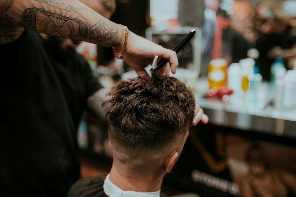 Hands in the hair at a chair, before a graft count exists